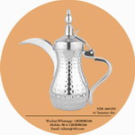 silver coffee pot with hammer dots